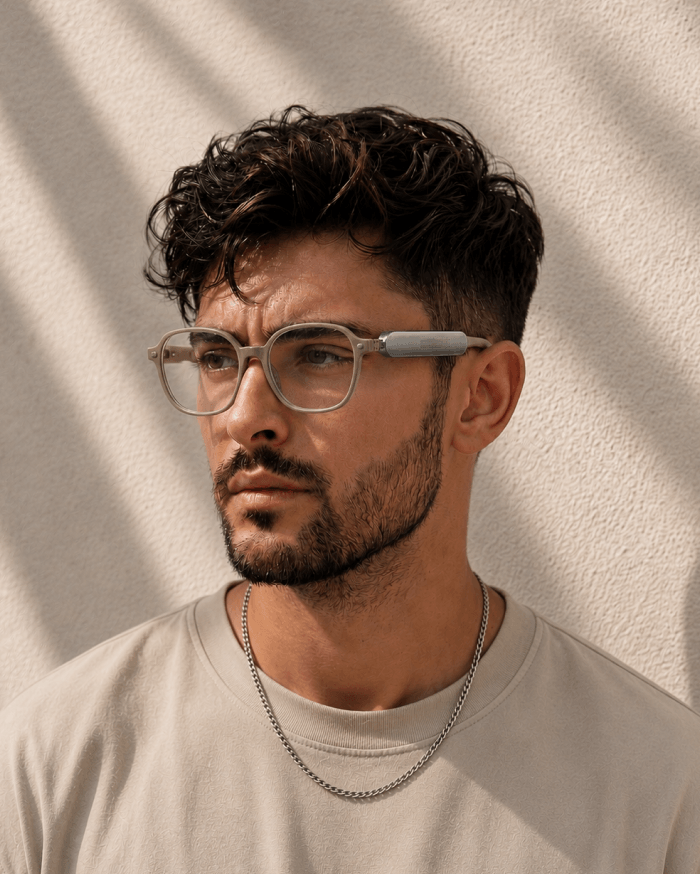 Person wearing glasses with Benev.Clip module